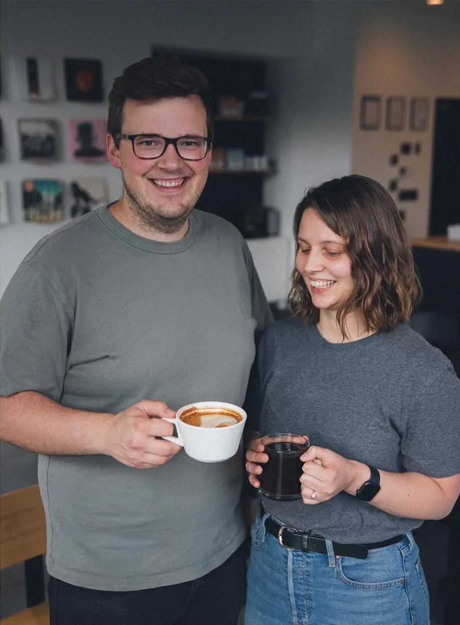 Tim and Lisa, the owners of Good Kid Coffee, with a cappuccino and a filter coffee